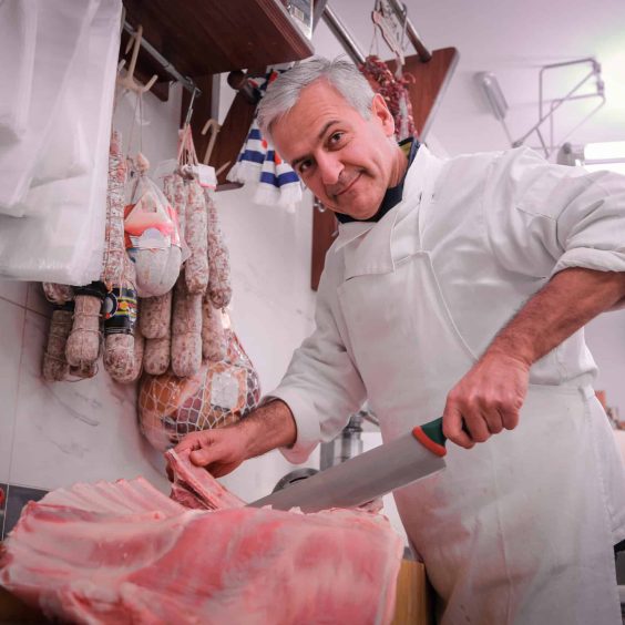 Butcher cutting meat Butcher cutting meat